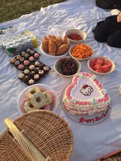 a table topped with lots of different types of cakes and desserts next to each other