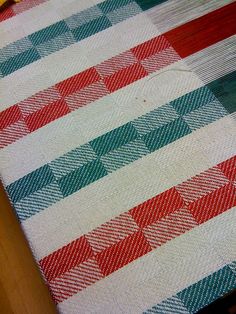 an american flag quilt on a wooden table