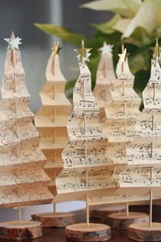 small wooden christmas trees with musical notes on them