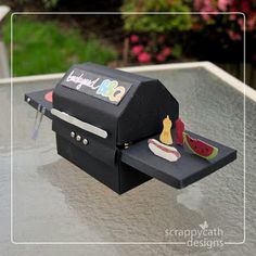 there is a paper model of a grill on the table