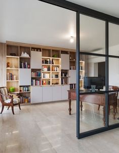 an open living room and dining area with sliding glass doors