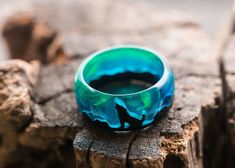 "Animal ring for men and women| Glow in the dark| Green wood wolf ring | magic engagement bands jewelry| best gift for girl for boyfriend  Materials: wood,  jewelry resin, epoxy resin, walnut size: Inner diameter from 15 to 24 mm Ring made of wood and epoxy resin \"Polar Night\" from GreenWood. Looking inside, you will certainly see a fabulous world with magical air bubbles that will attract the eyes of others. The ring is made of black hornbeam and jewelry resin. Recommendations for care The ri Luminous Ring Jewelry For Gifts, Luminous Ring Jewelry As A Gift, Wolf Design Ring Jewelry Gift, Wolf Design Ring Jewelry For Gift, Wood Costume, Mystery Jewelry, Resin Paintings, Ring Magic, Wood Fashion