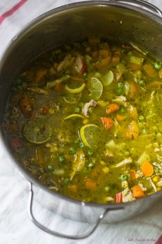 a pot filled with soup on top of a table