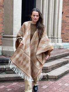 Caramel brown Open cape poncho for women and men Caramel Merino wool blanket poncho Warm Wrap Shawl Cape Poncho Open Front Cardigans brown One size fits fashionably for most everyone, short or tall, big or small. This piece is versatile for both Men's & Women's outdoor fashion, and can be used insider in cooler winter weather to keep warm while reading on the couch. CARE: Hand-wash and hang to dry, light iron if needed, or dry clean. MEASURES: Length at the front of the neckline to the bottom is Cozy Brown Shawl For Fall, Beige Alpaca Shawl For Fall, Fall Beige Alpaca Shawl, Cozy Brown Alpaca Poncho, Brown Wool Cape For Winter, Brown Cape For Cold Weather, One-size Brown Cape For Fall, Brown Winter Cape, One Size Brown Cape For Fall