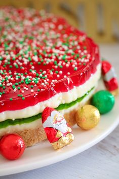 a christmas cake on a plate with candy and candies