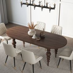 a dining room table with white chairs around it