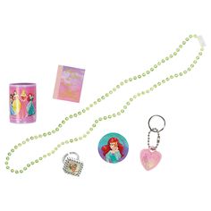 various items are arranged on a white surface including a keychain, card case, and necklace