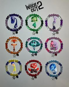 the inside out 2 bracelets are made with beads and charms from various cartoon characters