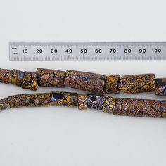 "Collectible Millefiore Beads, originally made in Venice, over 200 years ago. There are 14 beads on this strand. 10\" long. Beads are about 7-20mm diameter. Pictures show a variety of beads and their condition which is typical of antique collectible beads - beads are not in new and perfect shape. This listing is for the strand pictured. *Colors may vary due to batch, monitor color etc. See my other Collectible African Trade Beads in my shop for more fabulous old treasures!" Antique Round Spacer Beads, Sitting Buddha, African Trade Beads, Three Daughters, Daughter Necklace, Split Rings, Trade Beads, Gorgeous Shoes, Leather Cord