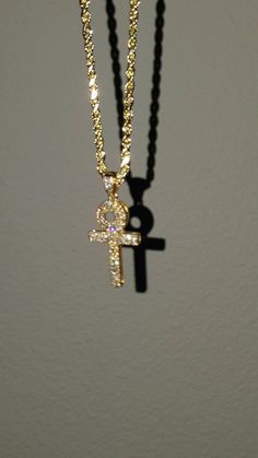 "Up for sale is a Beautiful Diamond Ankh Cross Pendant. Stackable, unisex Specifications: -Metal Type: Yellow Gold -Metal Purity: 14K -Pendant Length: 1.3\" Inches -Total Diamond Weight: 0.48 Carats -Color: G-F -Clarity: VS-VVS -96pcs of White Brilliant Diamonds -24 inch Rope chain included" Luxury Gift Cross Pendant Necklace, Luxury Symbolic Cross Pendant Necklace, Elegant 14k Gold Iced Out Necklace, Elegant Iced Out 14k Gold Necklace, 14k Yellow Gold Iced Out Necklace, Yellow Gold Iced Out Pendant Necklaces, Yellow Gold Iced Out Pendant Necklace, Luxury Gold Ankh Jewelry, Cool Rings For Men