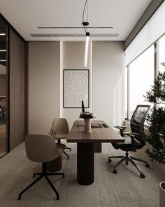 an office with two desks and chairs in front of large windows that look out onto the outdoors