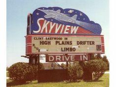 the sign for skyview drive in has an airplane on it's back end