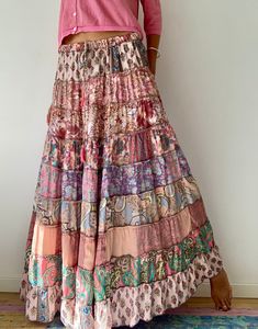 "This gorgeous colourful gypsie skirt is all fun to wear, boho style inspired long and flowy true hippy girl skirt it is made free size and floor length always one of a kind  patchwork, made of varieties of different fabrics with floral patterns,  very easy to wear and comfy  it has elasticated waist band, and will fit most of sizes S-L MEASURE One Size Fits Most length 39\"/100 cm waist 26-34\" CARE * Hand wash recommended * Hang to dry It is perfect outfit for everyday and evenings out or travels and festivals It is suitable to wear all year round with jumper and thights MATERIAL * Silk * Polyester * No lining  IMPORTANT NOTE  * Please note that colour shown on your monitor may vary from the colour of the fabric, due to light. If you have any doubts please contact us before purchuase." Bohemian Relaxed Skirt Maxi Dress For Spring, Bohemian Spring Maxi Dress With Relaxed Skirt, Bohemian Maxi Dress With Relaxed Skirt For Spring, Spring Bohemian Maxi Dress With Lined Skirt, Bohemian Wide Leg Maxi Dress For Spring, Bohemian Patchwork Skirt For Vacation, Bohemian Flowy Maxi Skirt For Spring, Bohemian Spring Maxi Skirt, Flowy Patchwork Tiered Maxi Skirt