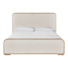 a bed with white linen and gold trimmings on the headboard is shown