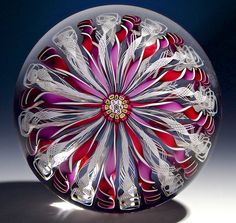 a colorful glass object sitting on top of a table