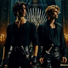 two young men standing next to each other in front of a iron throne with candles