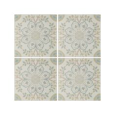 four square tiles with floral designs on them