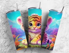 three colorful tumblers with an image of a tiger cub on the front and back