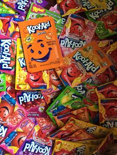 many different types of candy are stacked on top of each other in a pile together