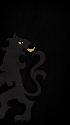 the silhouette of a black lion with yellow eyes on it's face and tail