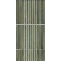 a green tile wall with vertical lines on it