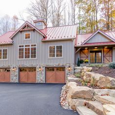 a large house with two garages in the front and one on the other side