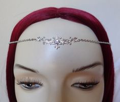 This is a new handmade headpiece. It is made with a small, silver tone centerpiece, accented with a high quality WHITE OPAL glass rhinestone that sparkles like crystal. Centerpiece measures 2" wide and 1/2" tall in the middle, and is worn with silver plated cable chain. Over all length is adjustable 21-24" with a lobster clasp and chain extender in the back. If you would like a different length, please send us a message. Circlet Crown, Handmade Headpiece, Tiara Headband, Silver Head Piece, Rainbow Topaz, Celtic Goddess, Onyx Crystal, Crown Tiara, Fairy Queen