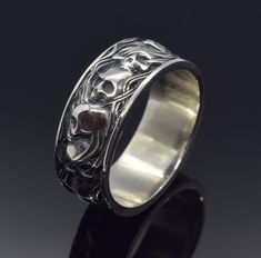 Skulls in Smoke Gothic Band Ring, 925 Sterling Silver Goth Promise Ring, Engraved Wedding Ring, Gothic Ring. ArmenianJewelryHouse personnel do everything to complete the customer's safety and experience.  Item Details  - Material: 925 Silver - Weight ~ 10.00 Grams(Depending on size) - Gender: Male / Female ✔ Shipped in 5-7 Business Days ✔ Free shipping! ✔ The product will be sent bubble-wrapped or in a box to avoid any damage during shipping.  Policies for Return, Exchanges & Order Cancellations Goth Promise Rings, Gothic Engraved Rings For Anniversary, Gothic Engraved Wedding Rings, Silver Gothic Rings With Polished Finish, Silver Gothic Skull Ring For Anniversary, Silver Gothic Rings In Metal, Engraved Wedding Ring, Gothic Bands, Nickel-free Silver Gothic Skull Ring