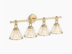 three light brass finish bathroom fixture with clear glass shades on the arms and bottom half