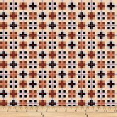 an orange and black checkered pattern on white fabric with a ruler in the foreground