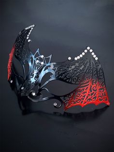 Our women's bat metal masquerade mask, adorned with red accents and sparkling rhinestones, is your key to a night of gothic enchantment and timeless beauty. Designed for hours of comfortable wear, so you can dance and mingle with ease. Whether you're attending a gothic masquerade ball or simply looking to make a dramatic entrance, this mask ensures you'll be the center of attention.


Age Group/Gender - Adult/Women

Size/Type - One size fits all adults

Mask Color - Red/Black

Mask Material - La Gothic Adjustable Masquerade Mask For Costume Party, Gothic Adjustable Masquerade Mask, Gothic Masquerade Eye Mask For Theater, Gothic Eye Mask For Theater Masquerade, Gothic Eye Mask For Theater, Adjustable Black Fantasy Masquerade Mask, Gothic Black Masquerade Mask For Theater, Black Gothic Masquerade Mask For Theater, Gothic Eye Mask For Evening Masquerade