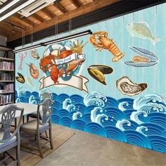 a dining room with a mural painted on the wall and chairs in front of it