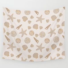 a wall hanging with shells and seashells on it