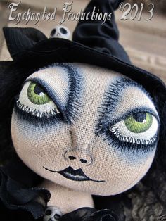 a doll with green eyes and black hair