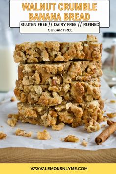 a stack of granola bars sitting on top of a table next to a glass of milk