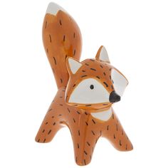 a ceramic fox figurine on a white background