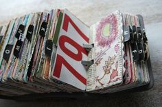 a pile of magazines sitting on top of a table