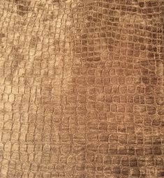 the texture of an upholstered fabric is brown