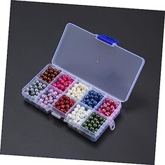 an open plastic box filled with lots of beads