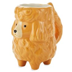 an orange ceramic bear mug on a white background