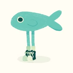 a blue fish standing on top of a pair of shoes in front of a white background