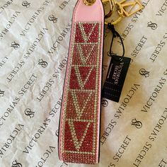 Brand New Victoria’s Secret Pink Rhinestones Wristlet Strap. Very Cute Bling Wristlet Strap! Add This Wristlet To Pouches Or Keys To Keep Essentials Close. In A Lux Sparkle Finish With Signature V-Monogram. Attached Totes, Backpacks, Or Can Be Used Separately As Keychain 3” L X 6 3/4” H Imported Metal And Polyurethane ***Price Is Firm*** Secret Wallet, Mirror Keychain, Strap Keychain, Ring Logo, Pink Keychain, Love Keychain, Victoria Secret Tote Bags, Card Holder Purse, Pink Envelopes