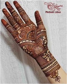 the hand is decorated with intricate designs