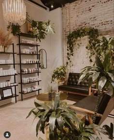 Salon, Salon Decor, Sofa, Waiting Area, Black Leather Couch, Wood, Hair Salon Simple Modern Salon Design, Nature Salon Design, Salon Plants Decor, Natural Salon Decor Interior Design, Esthetician Room Decor Green, Salon Wood Wall, Brick Wall Spa Room, Moody Hair Salon Decor, Hair Salon Room Decor