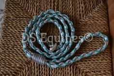 a blue and white rope on top of a wooden table