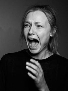 black and white photograph of a woman with her mouth open