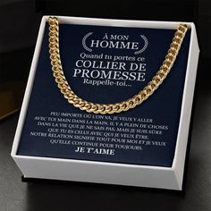 a box with a gold chain on top of it and an advertisement in the back