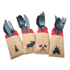 four forks, knives and spoons in a paper bag with moose designs on it