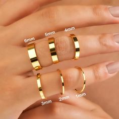 three different types of gold rings with measurements for each ring and the size to choose from