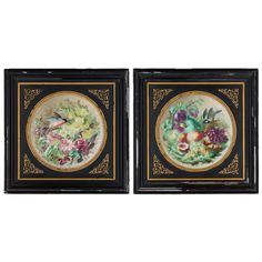 two framed paintings with flowers and fruit on the bottom one is black, the other is gold